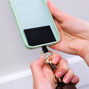 MULTIFUNCTIONAL PHONE STRAP WITH ZIPPERED POUCH